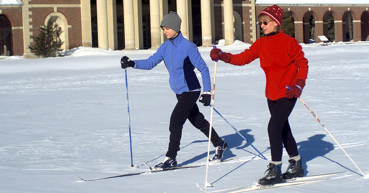 two cross country skiers in a park