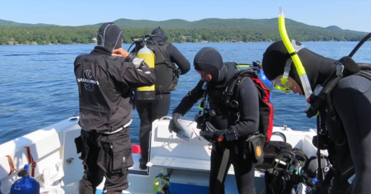 scuba divers on a boat