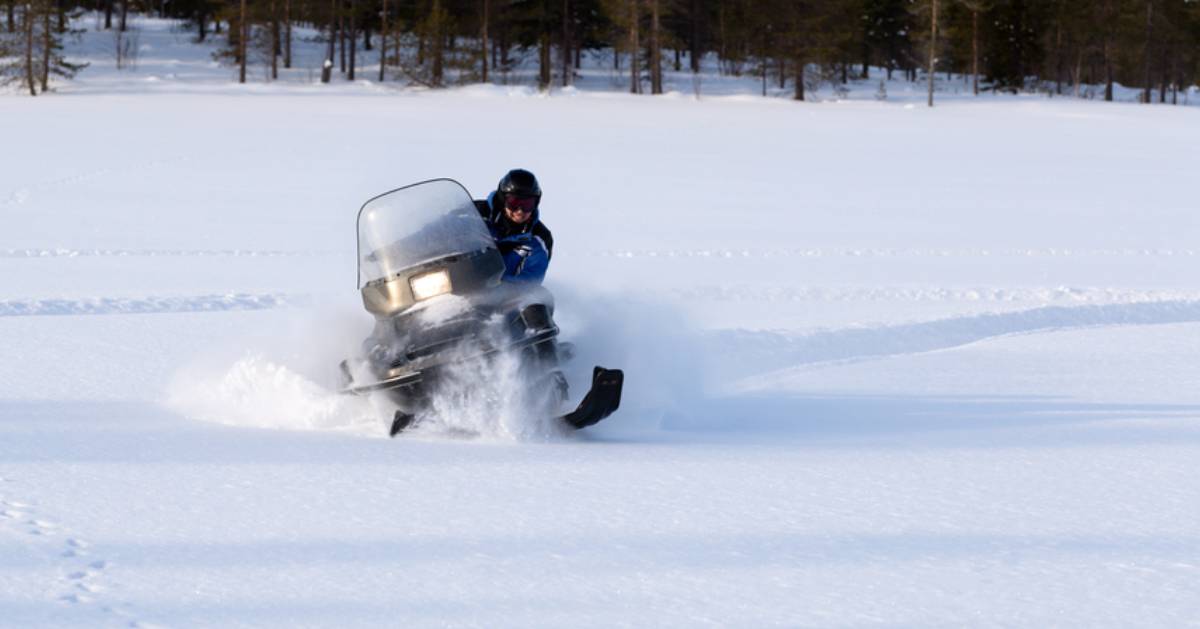a person riding a snowmobile