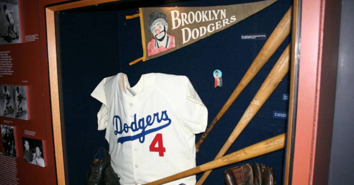 dodgers shirt and baseball bats on display