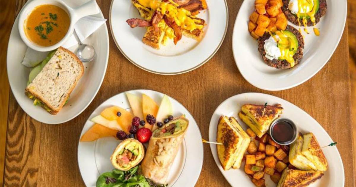 plates of breakfast food on a wooden table