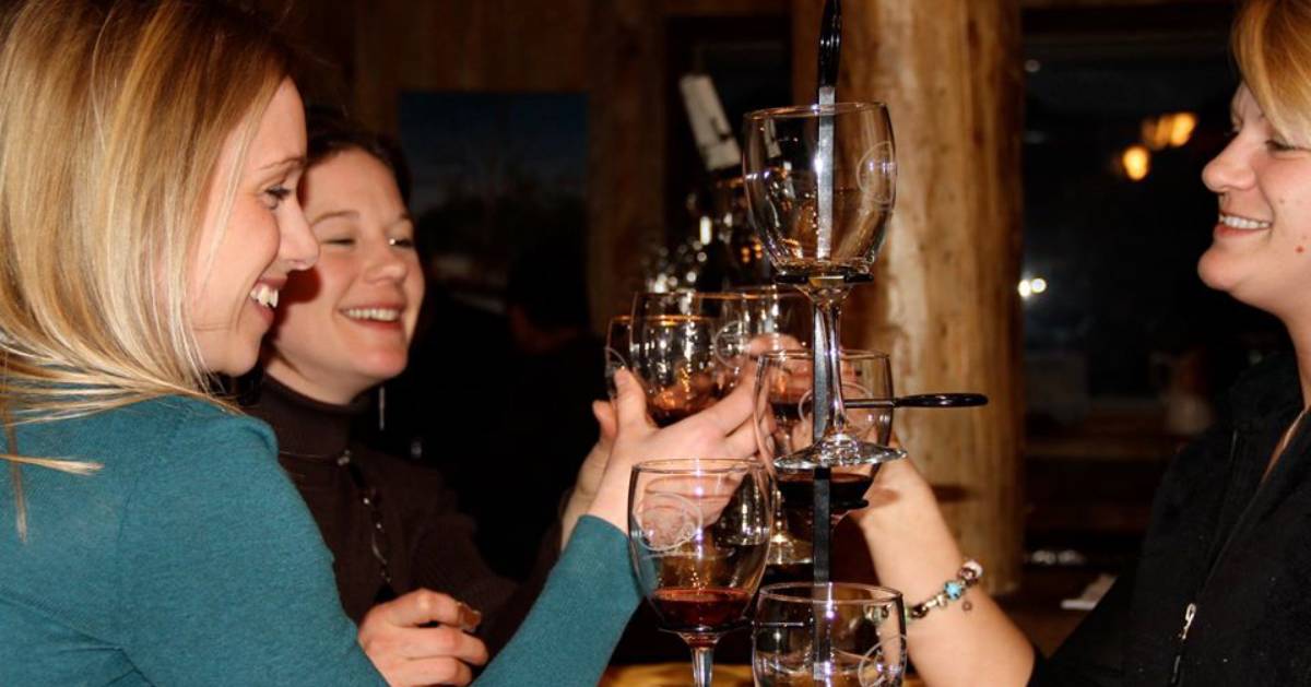 women tasting wines from glasses