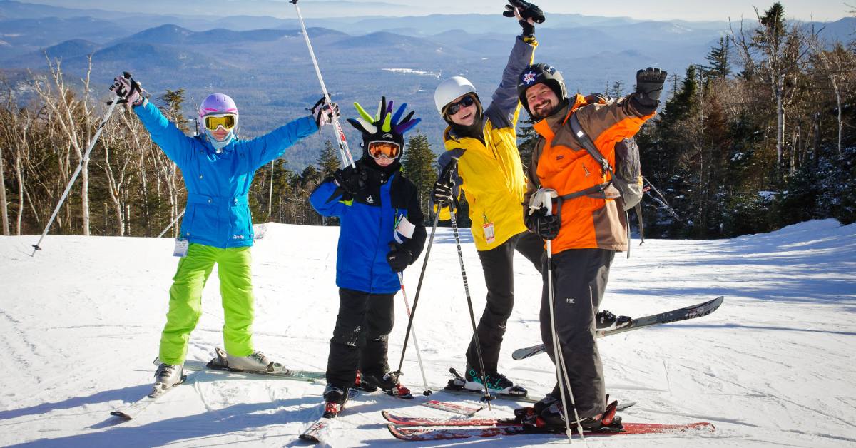 man, woman, and two kids on a ski slope