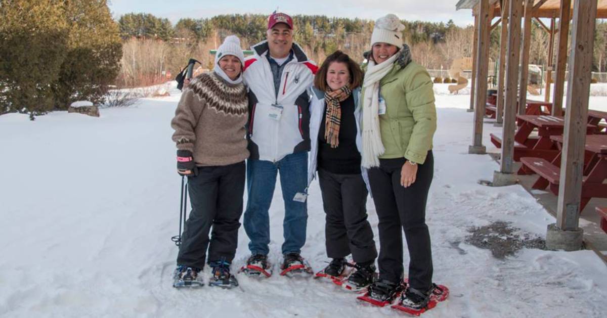 group of happy snowshoers