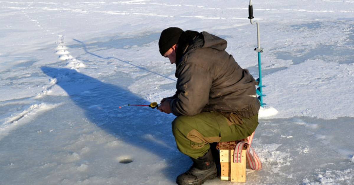 an ice fisherman on the ice