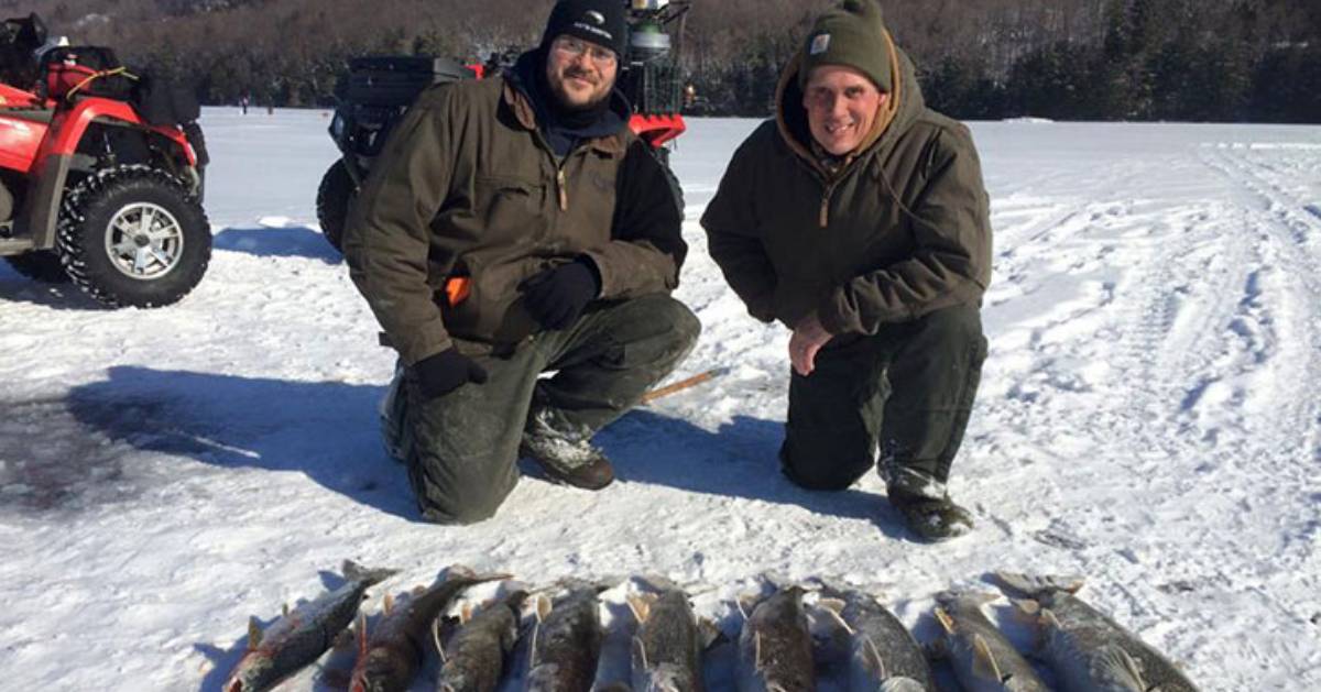 two ice fishermen with fish 