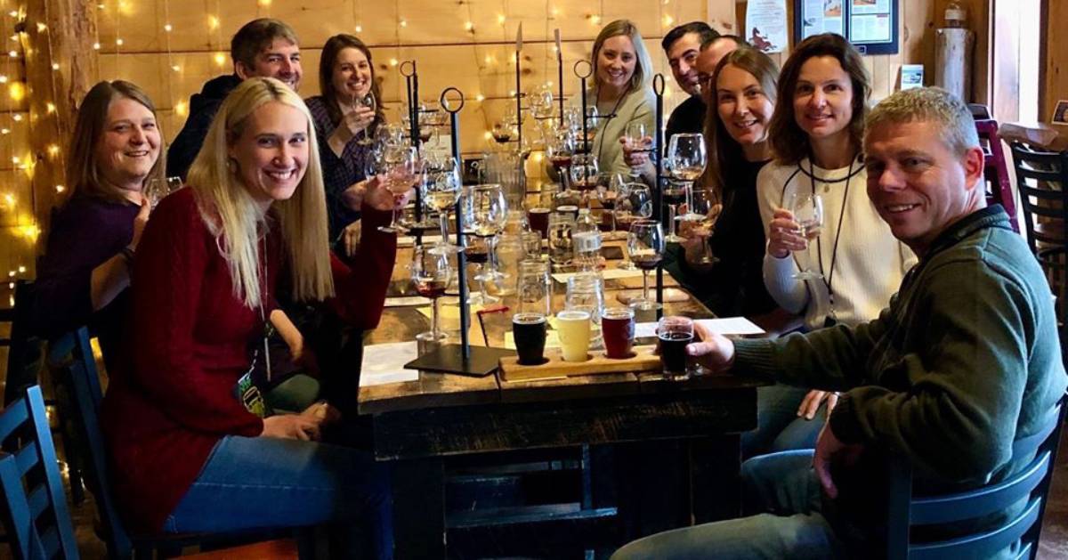 group of people at a table for a wine tasting