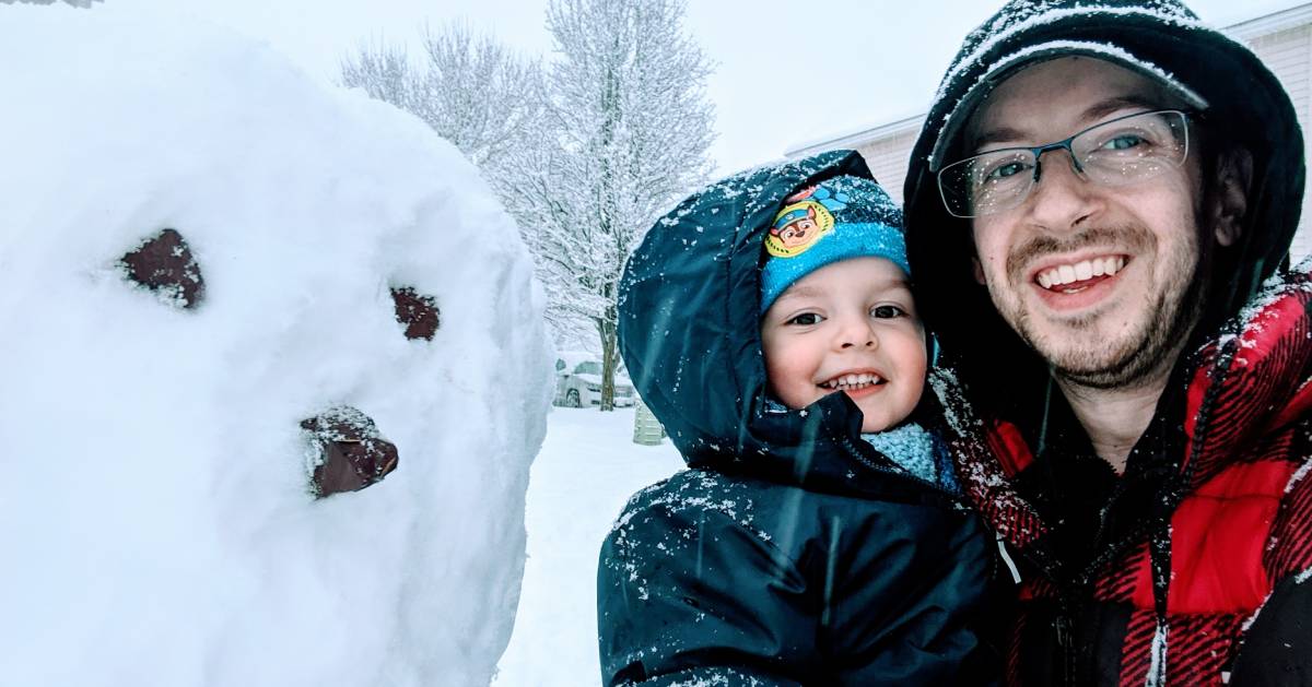 kid and dad and snowman
