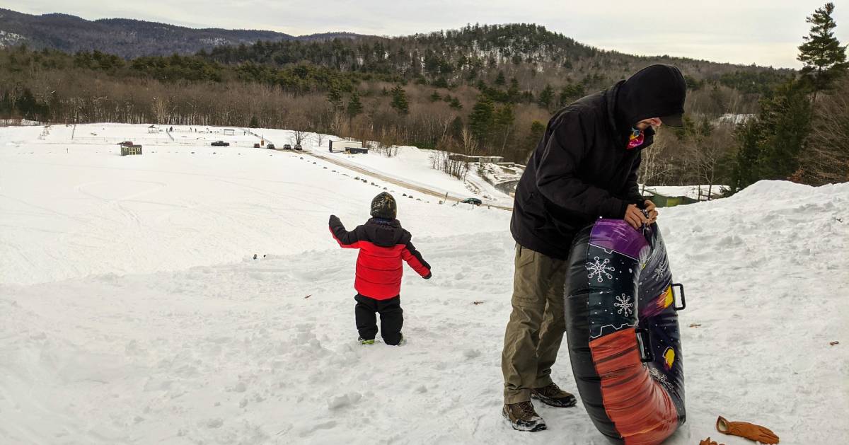 kid and dad and snowtube