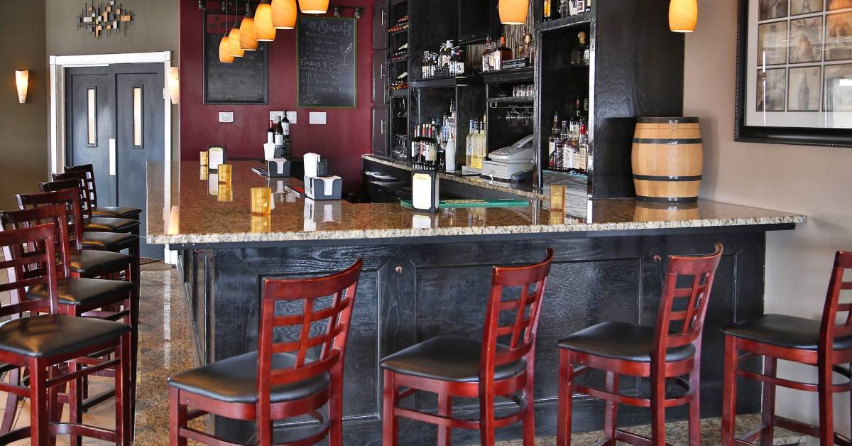 red chairs around a bar