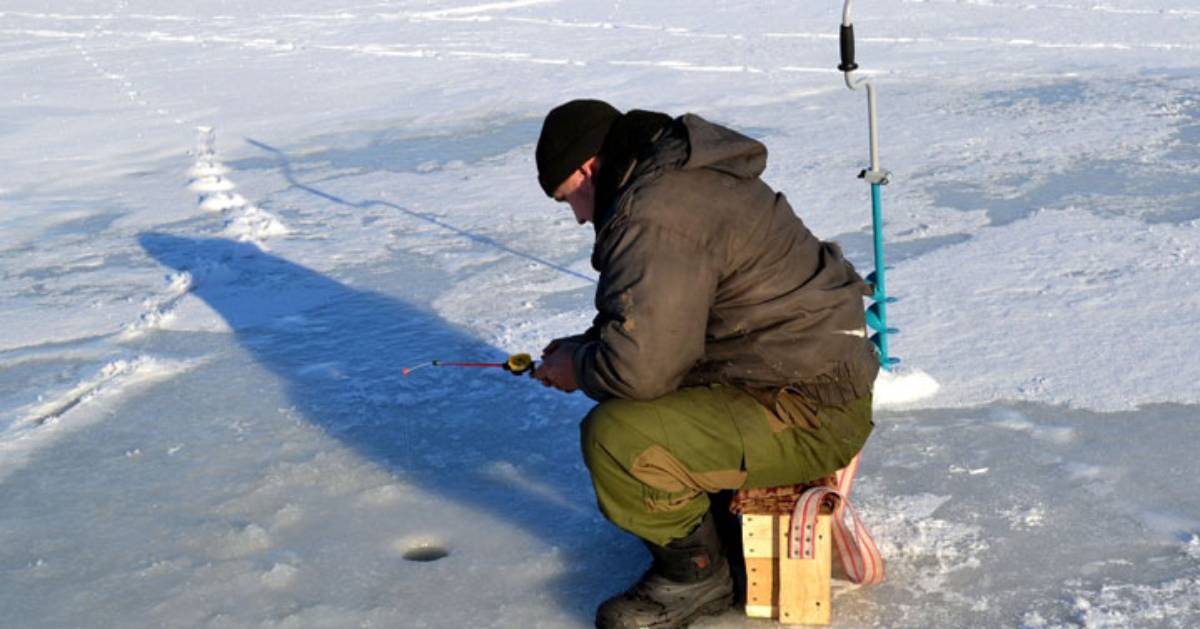 man ice fishing