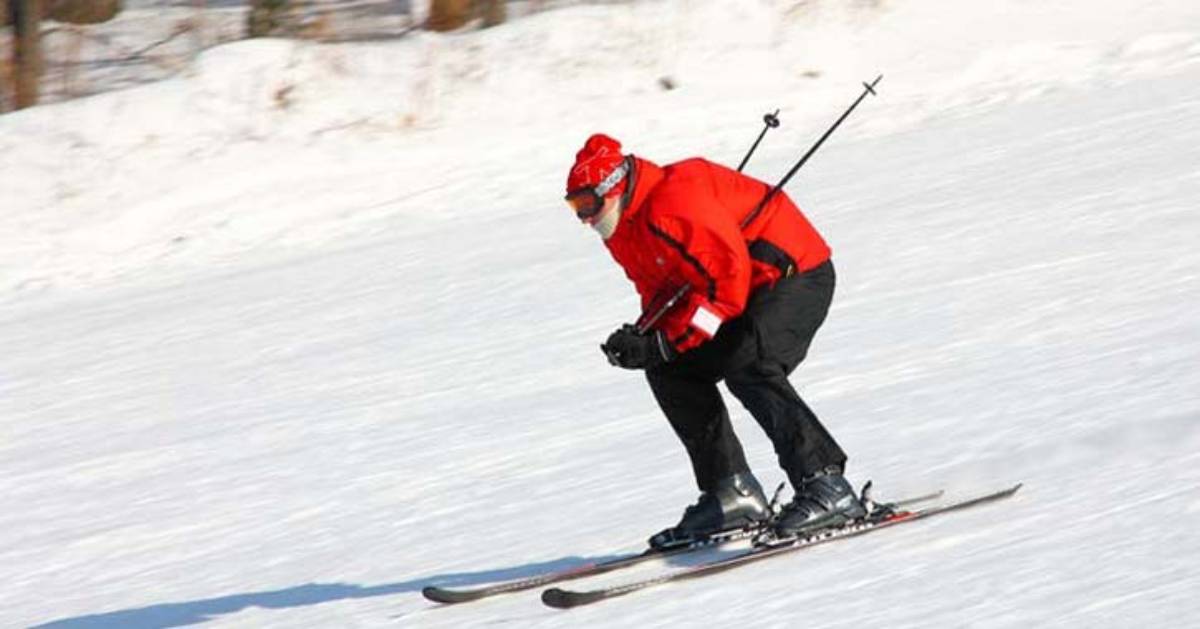 skiing down a snowy hill