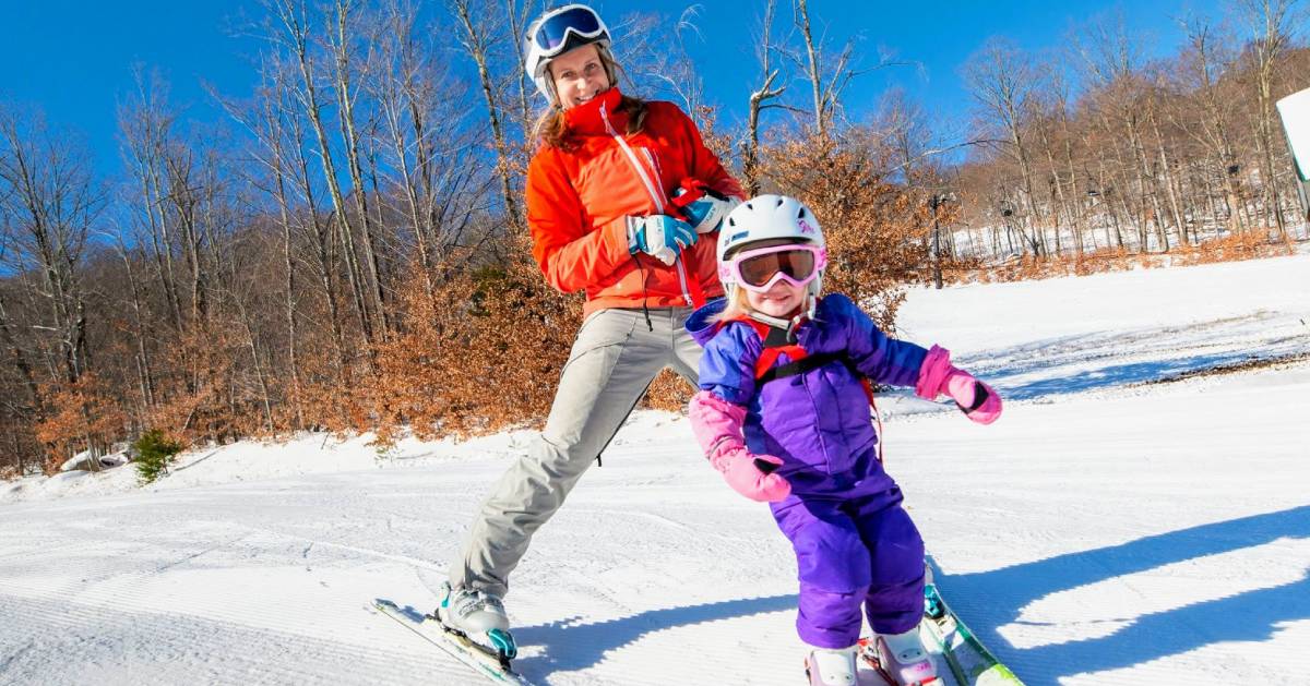mom and kid skiing