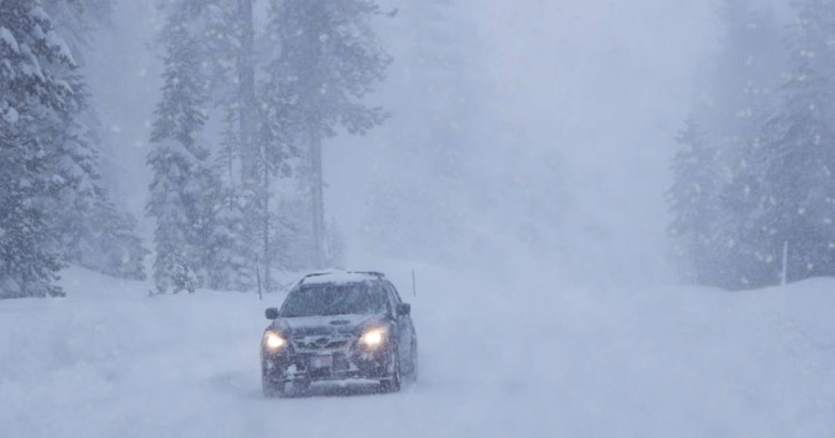 car driving in snowy weather