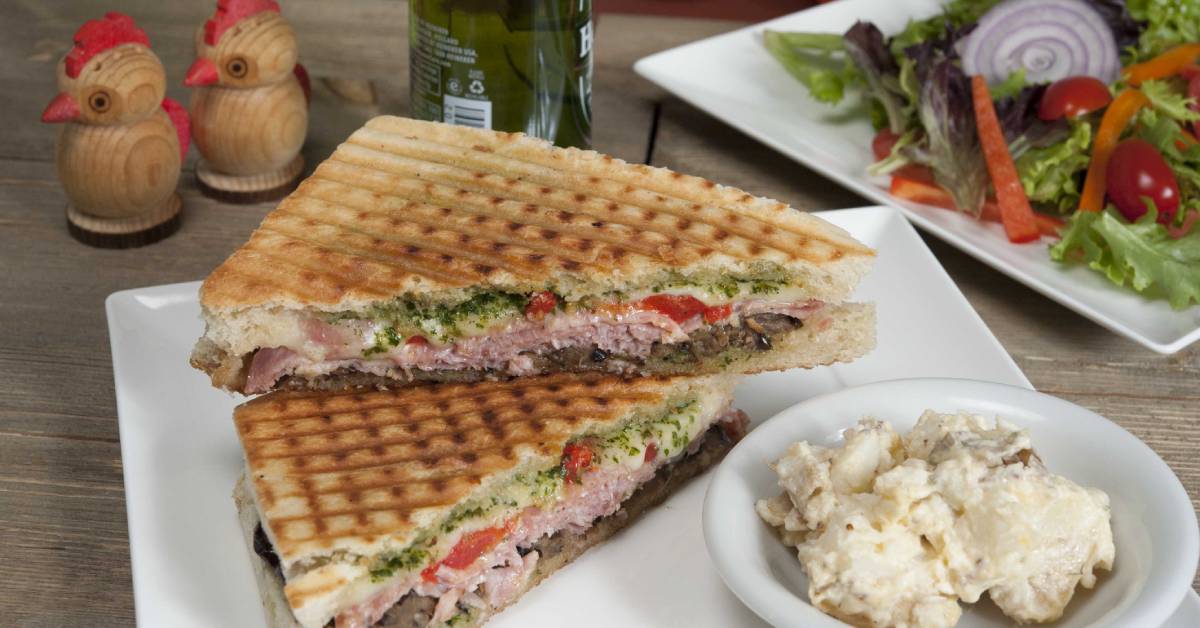 paninis and mashed potatoes on a plate