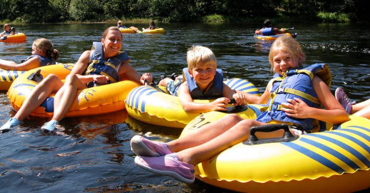 kids and adult woman lazy river tubing