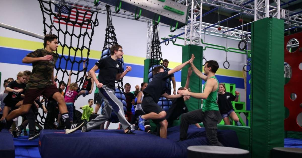 teens on a jump pad in gym