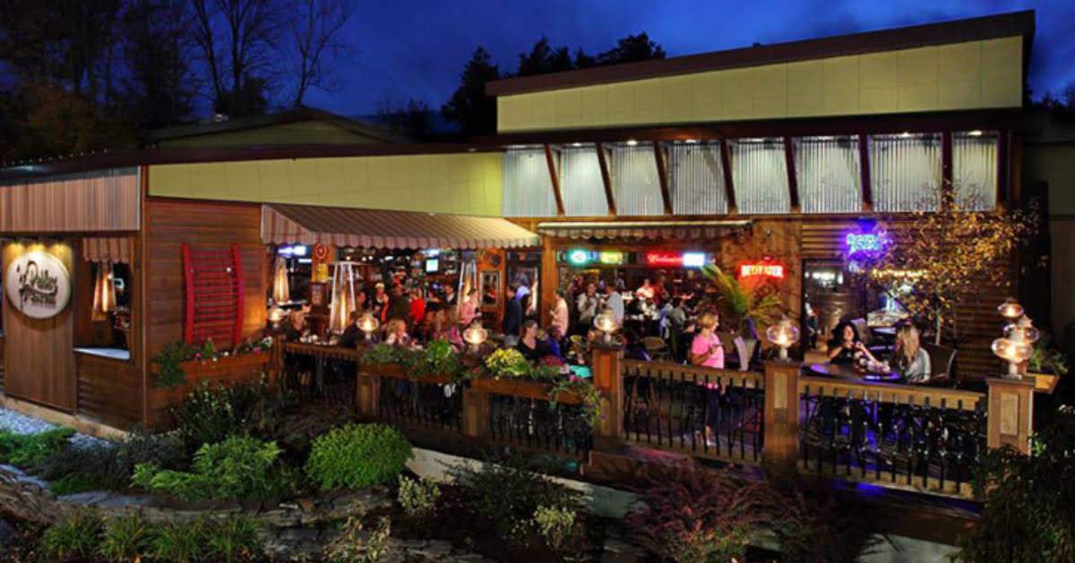 people dining on patio at restaurant