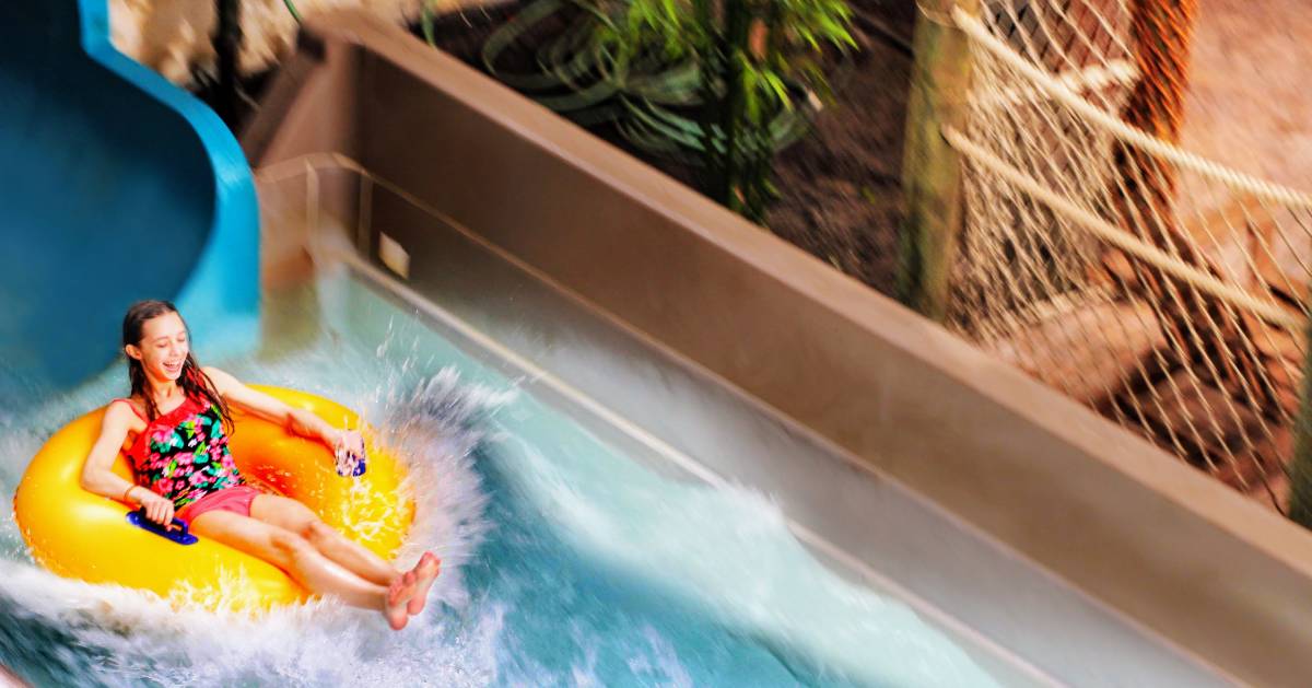 girl on tube in water park