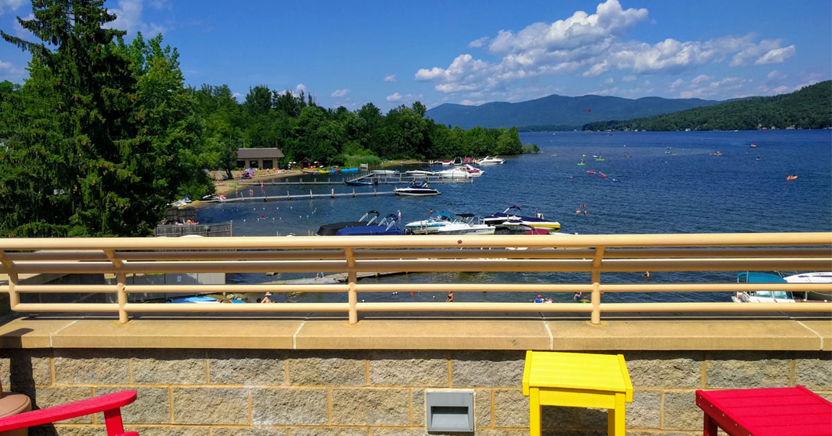 view of water and boats from deck