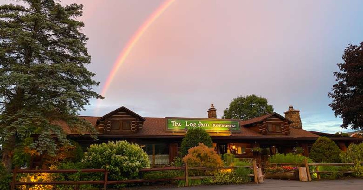 Log Jam Restaurant and rainbow in sky