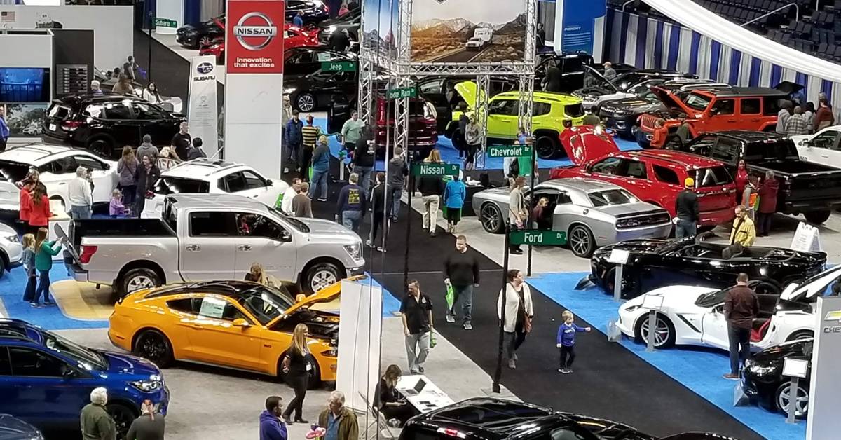 overhead view of people at an indoor auto show