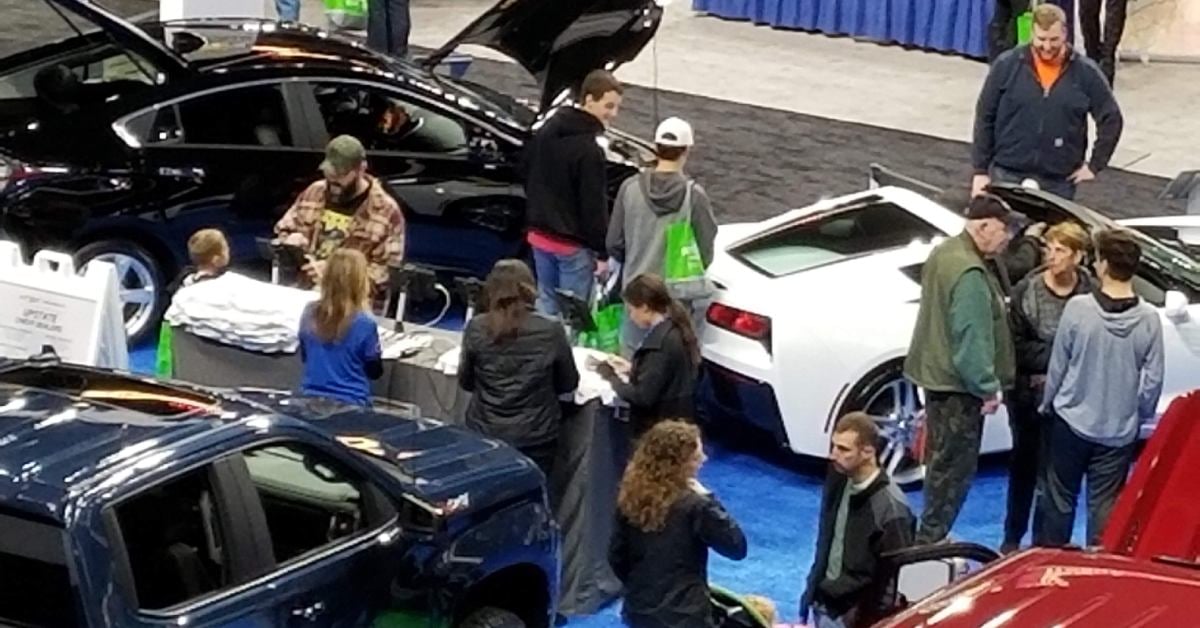 view of people browsing an auto show