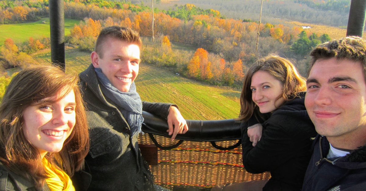 two couples on balloon ride in the fall