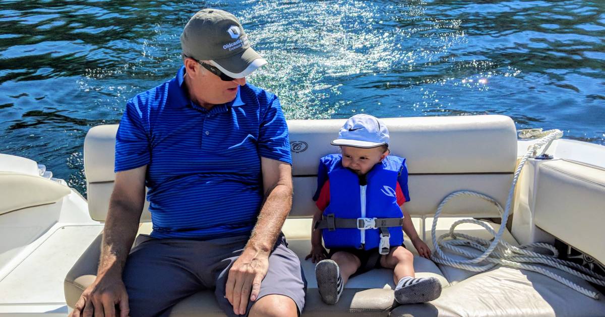 grandfather and toddler on boat