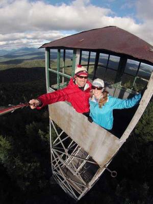 couple in fire tower takes selfie with selfie stick