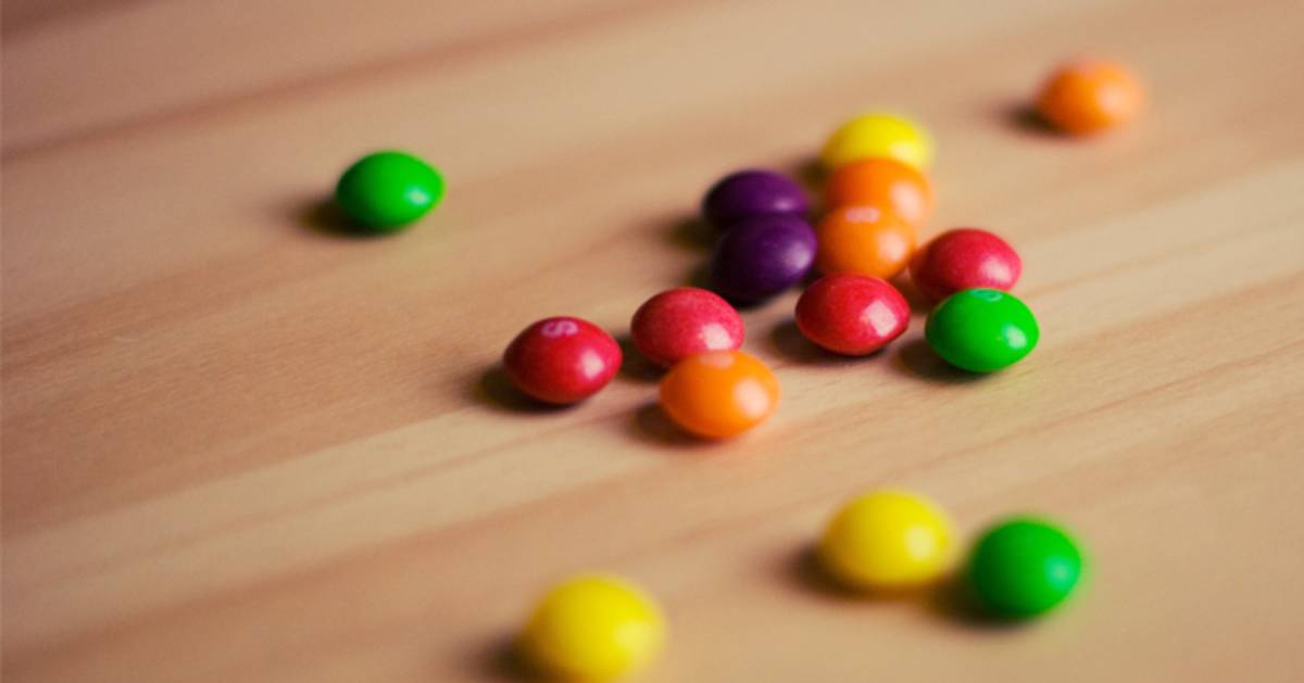 several Skittles spread out on a table