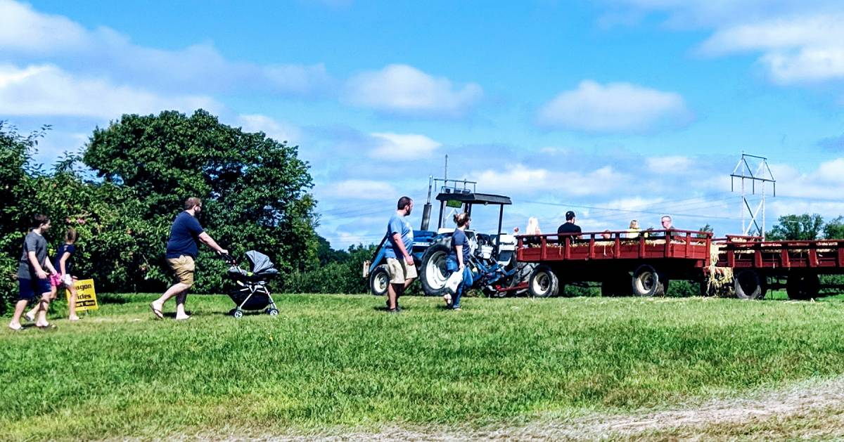 people getting onto a hayride