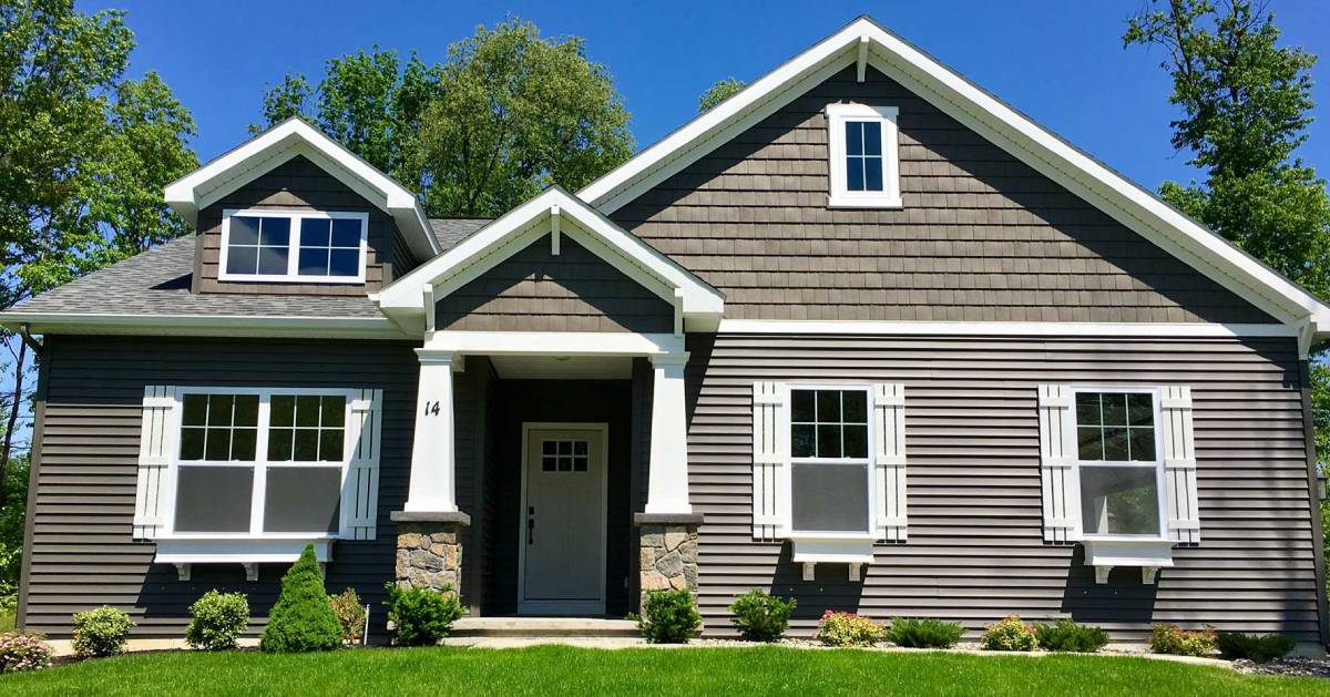 house on grassy lawn