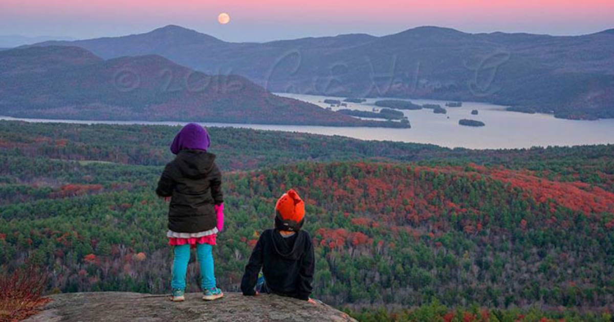 two kids on mountain summit