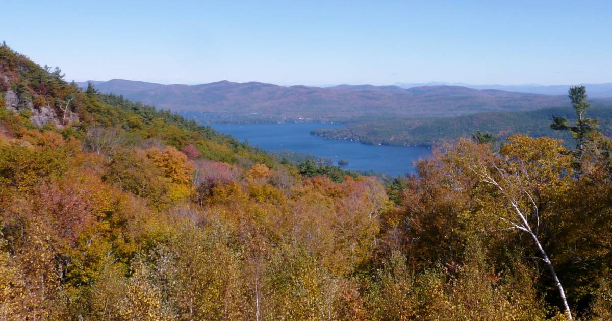 view of foliage and lake from summit