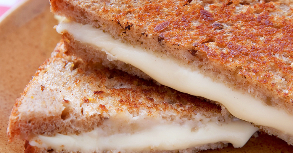 close up of a stacked grilled cheese sandwich