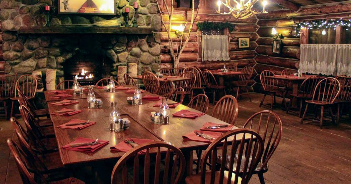 fireplace inside dining room with tables