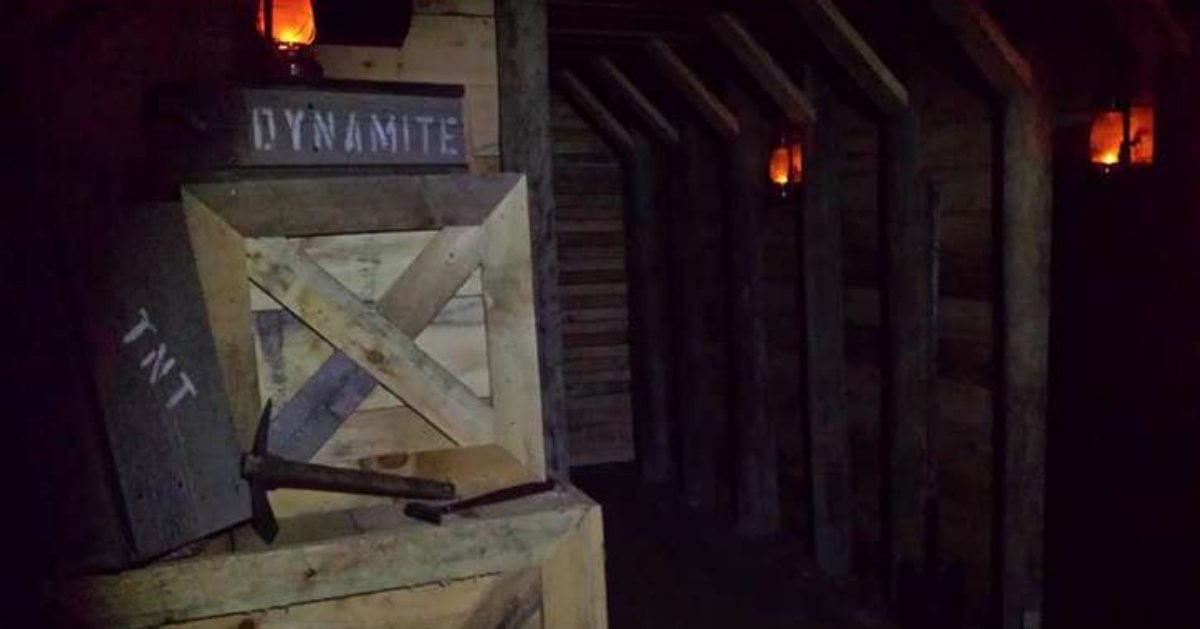 a creepy dark room with a box that says dynamite