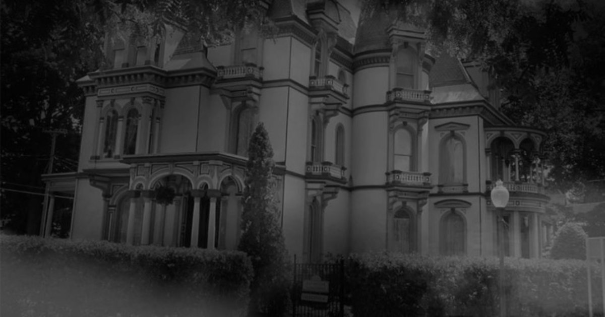 black and white photo of spooky mansion