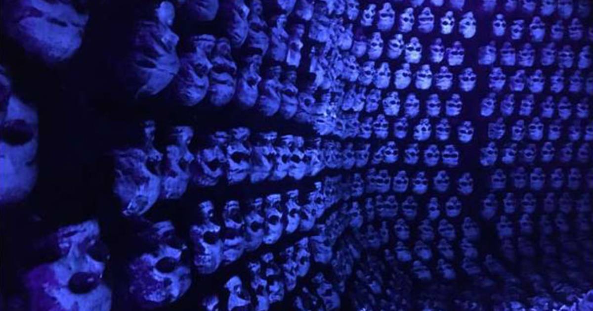 a wall of bluish purple skulls
