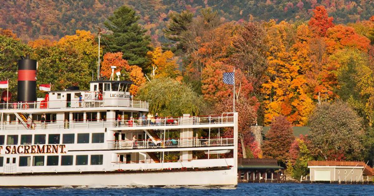 steamboat on the lake with fall foliage in the background