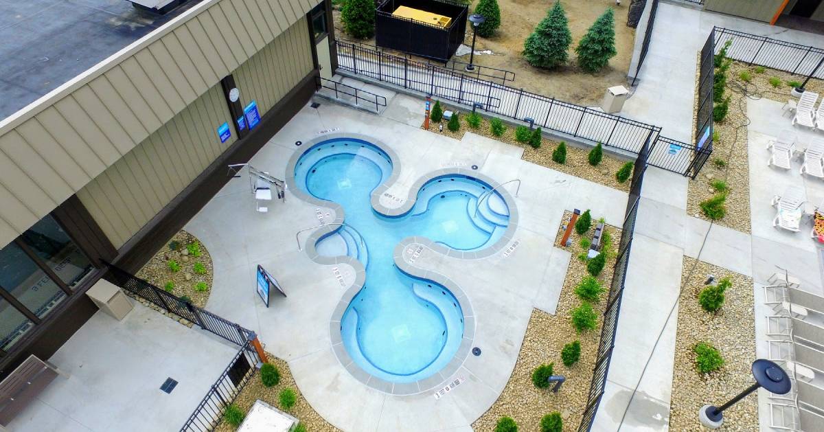 aerial view of pool shaped kind of like a clover