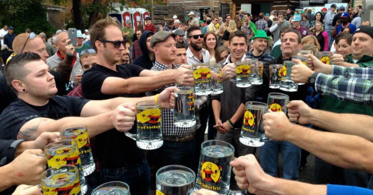 group of people cheersing with beer glasses