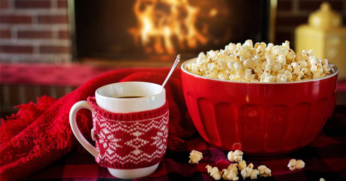 cocoa in mug and popcorn bowl nearby