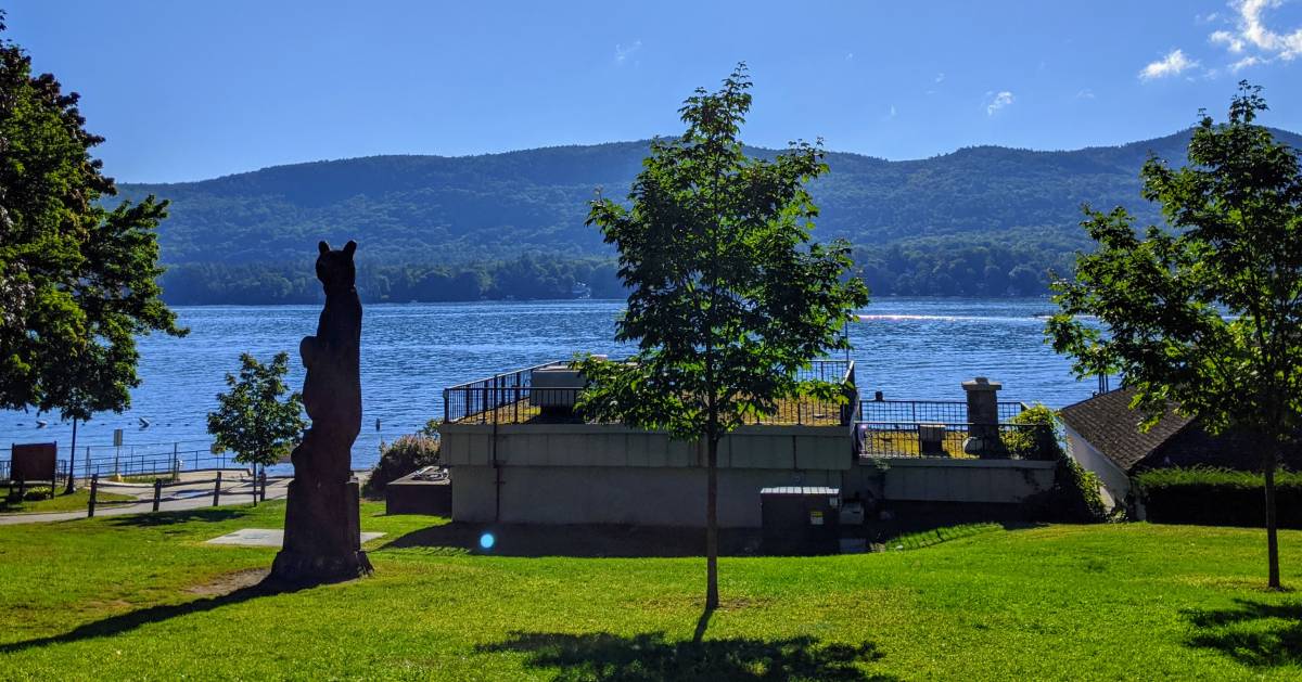 bear statue in park by lake
