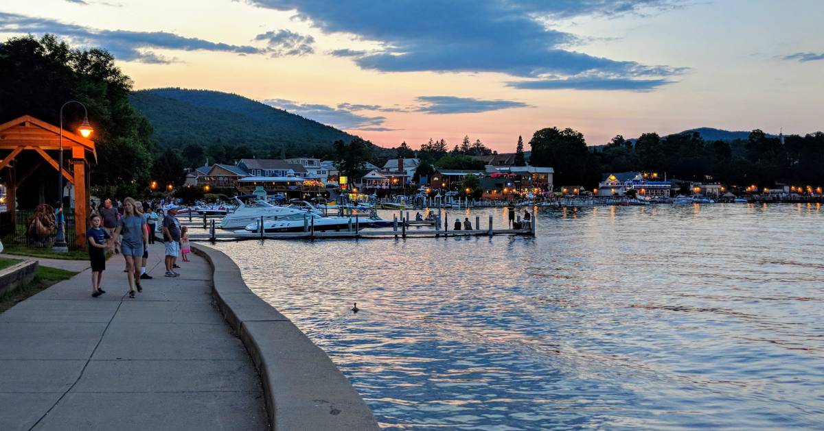 people by the lake at dusk