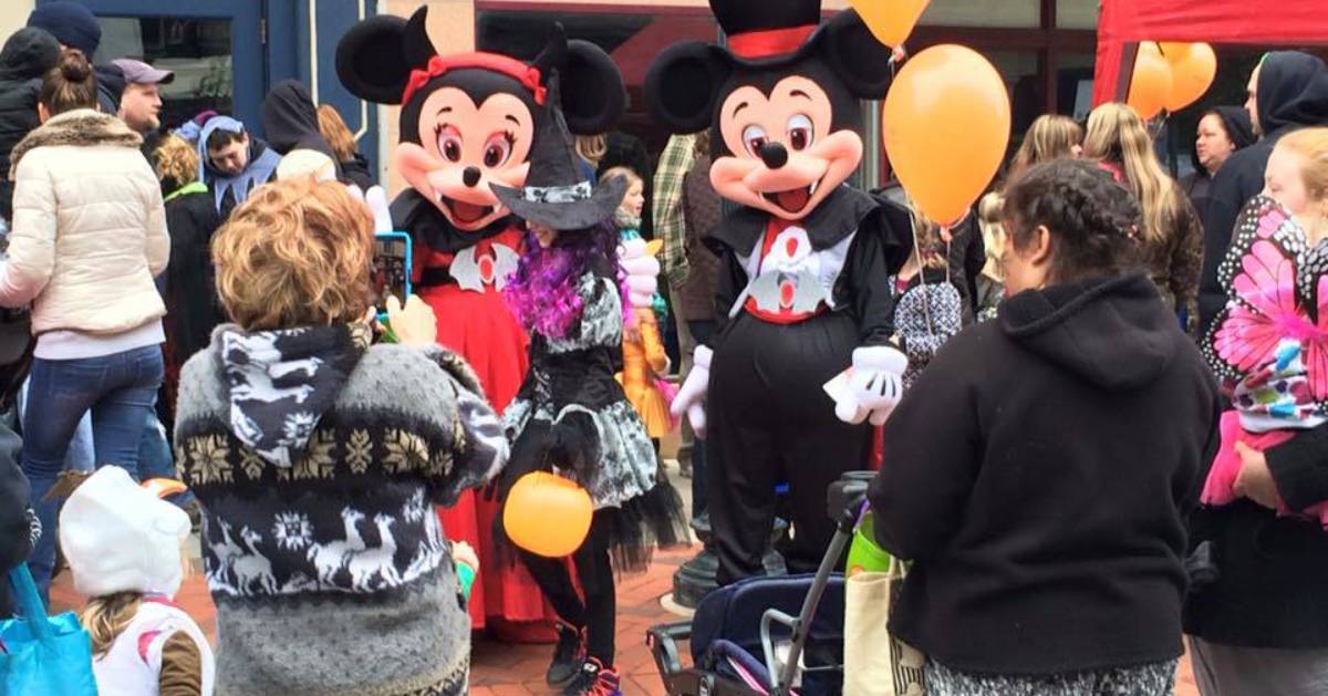 Mickey and Minnie characters at a Halloween event