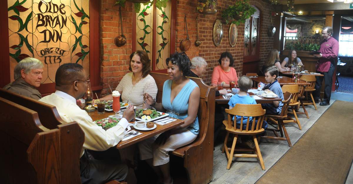 adults and kids eating at olde bryan inn