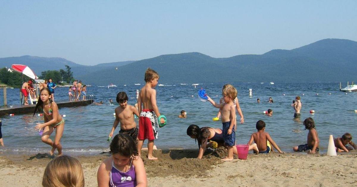 kids playing on a beach in bolton landing