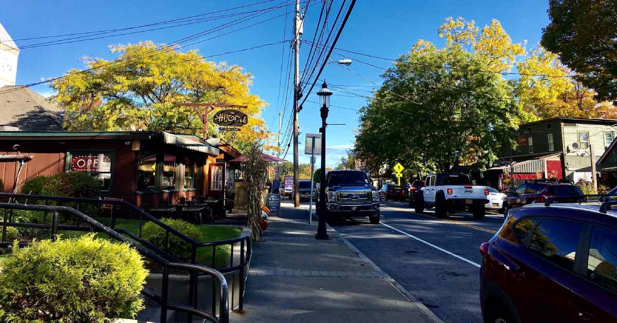 businesses and cars along lake shore drive in bolton landing